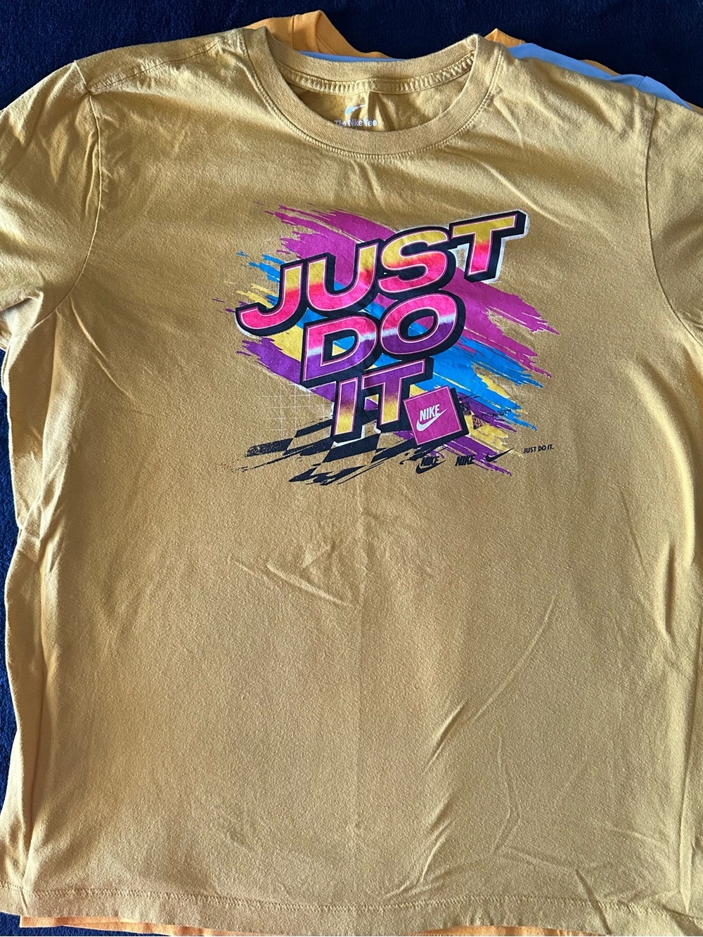 Nike Mustard Yellow Short-Sleeve Tee with Multicolor 'Just Do It' Graphic